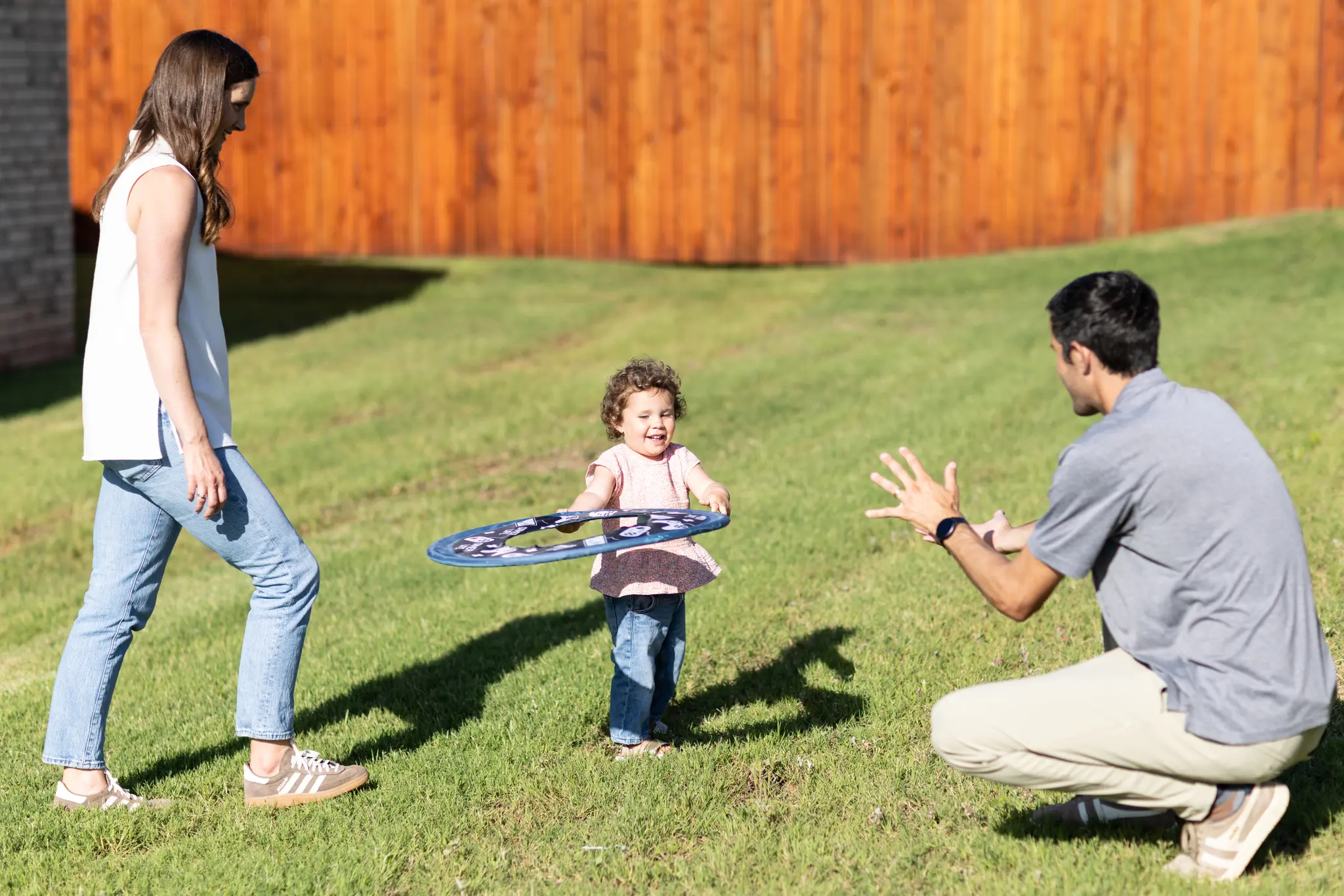 Family Having Fun in the Backyard of a Beacon Home