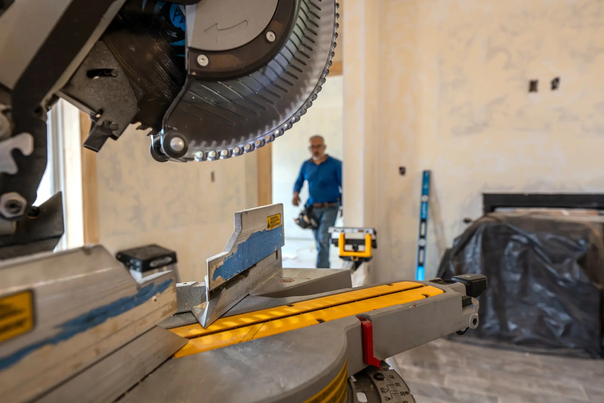 Blog post image: Trim carpenter and miter saw in Beacon home in Edmond, Oklahoma.