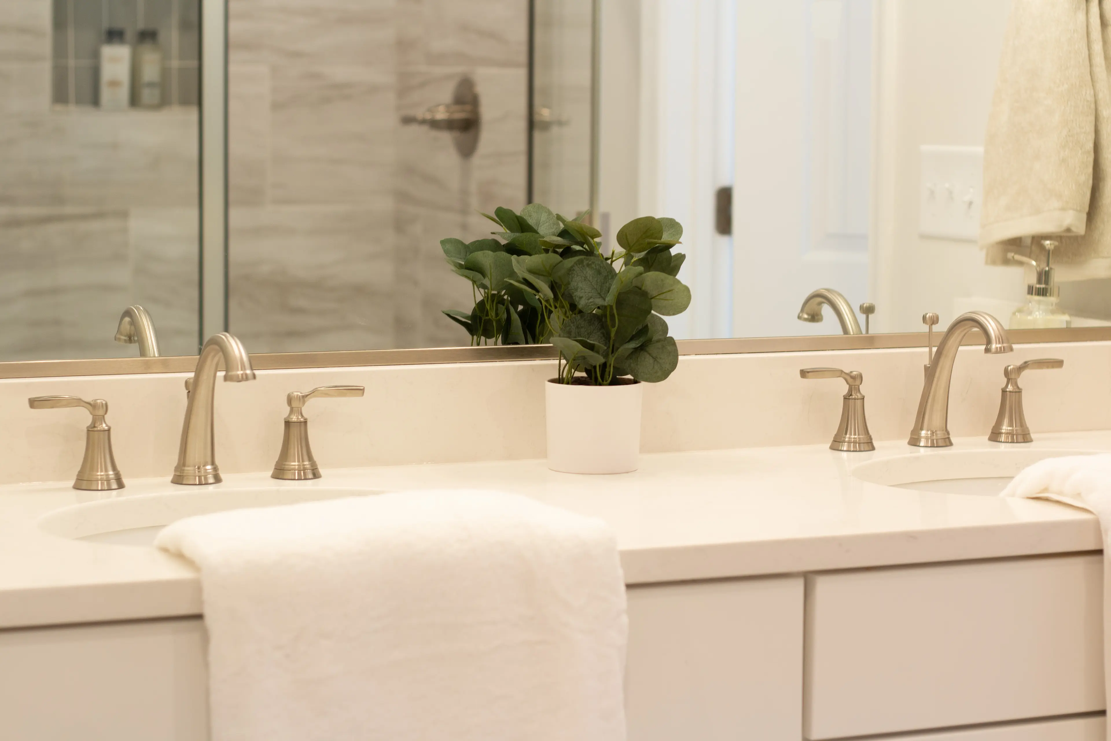 Slide - Owner's Baths Feature Double Vanity & Tiled Shower