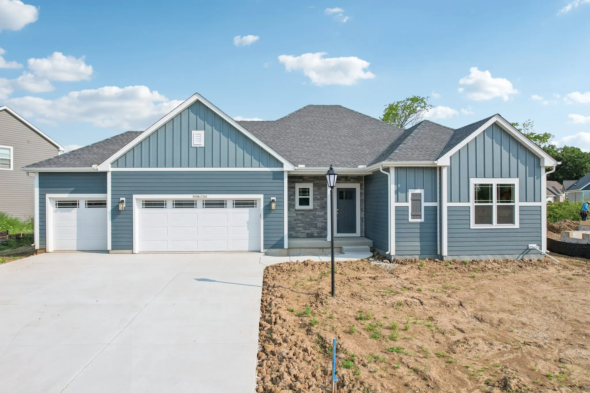 The Drake Prairie Elevation 3 car garage 
