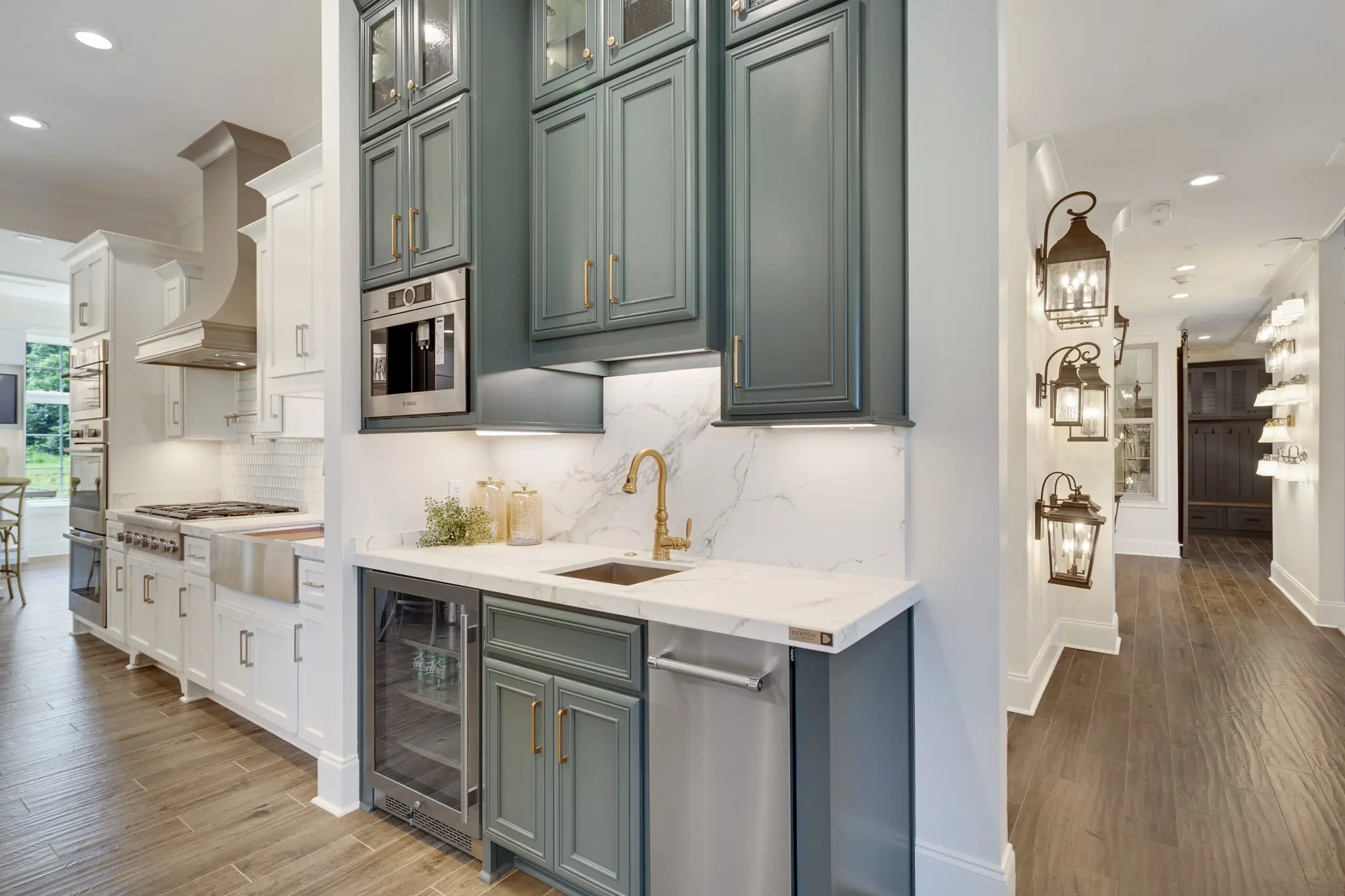 Magnolia Homes Design Center with a vibrant butler's pantry display complete with coffee maker and drink fridge.