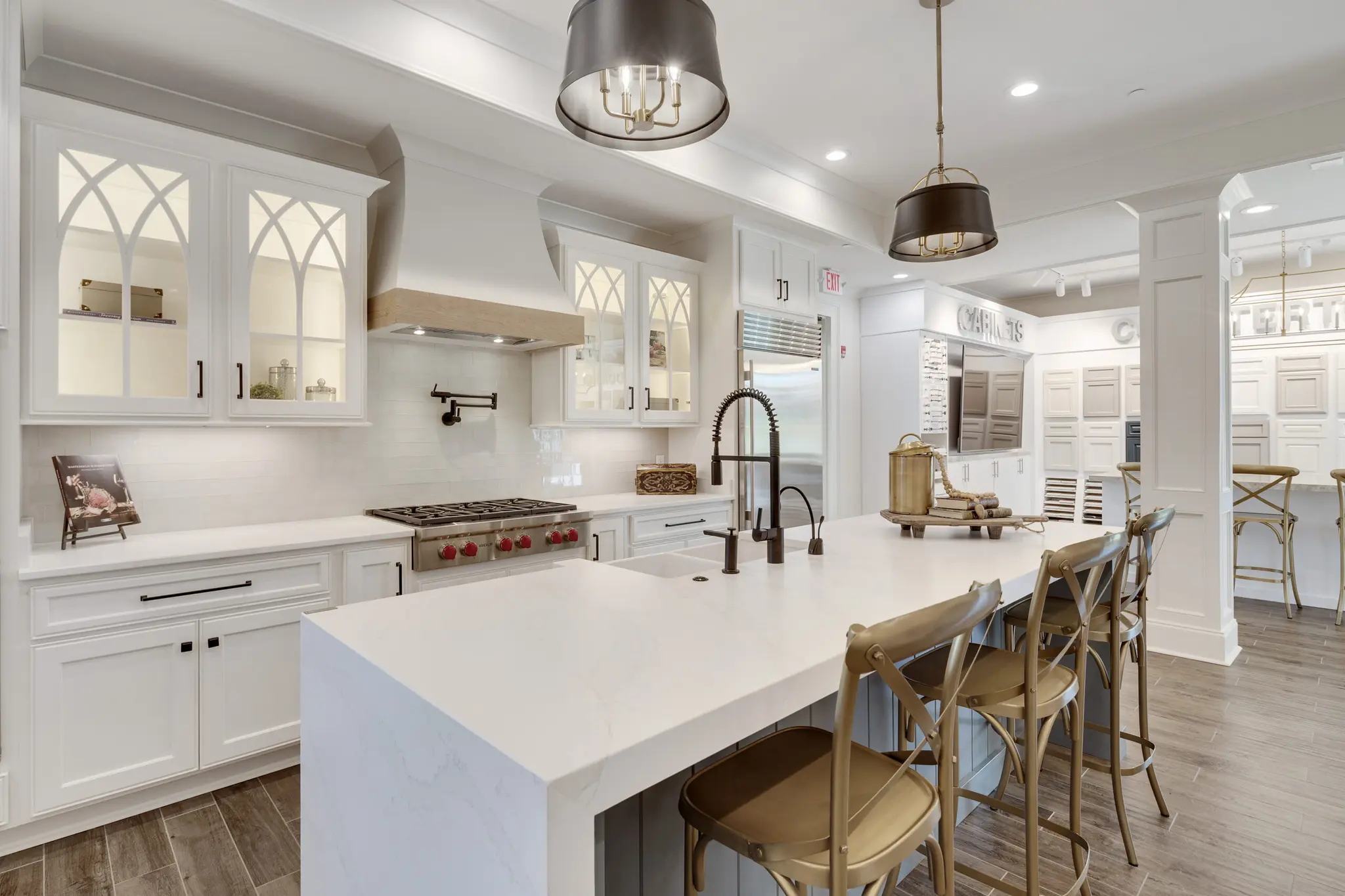 Magnolia Homes Design Center kitchen with stunning glass cabinets with beautiful design. 