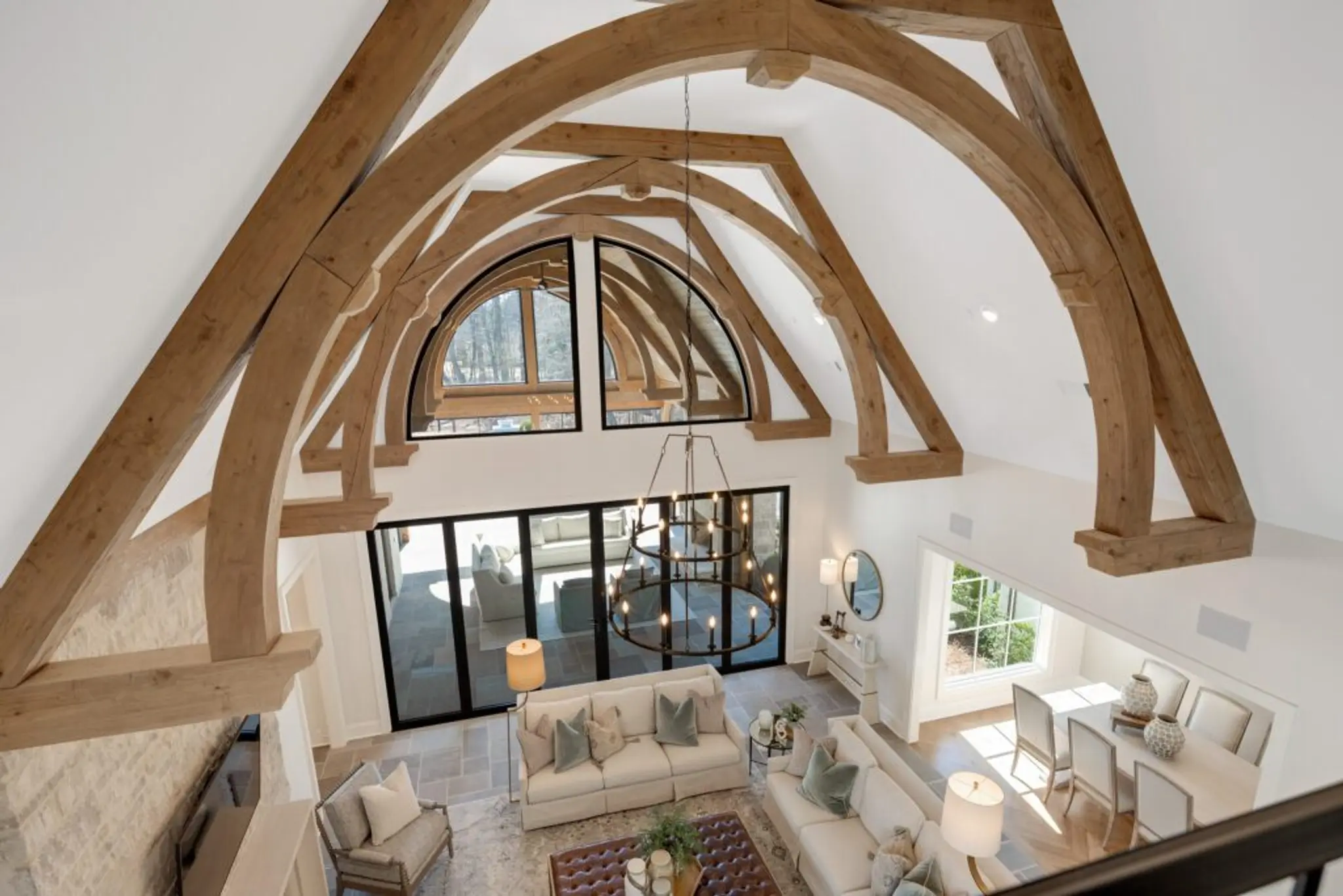 Award-winning Magnolia Homes Family Room with Exposed Cedar Beams, natural light, and comfy seating
