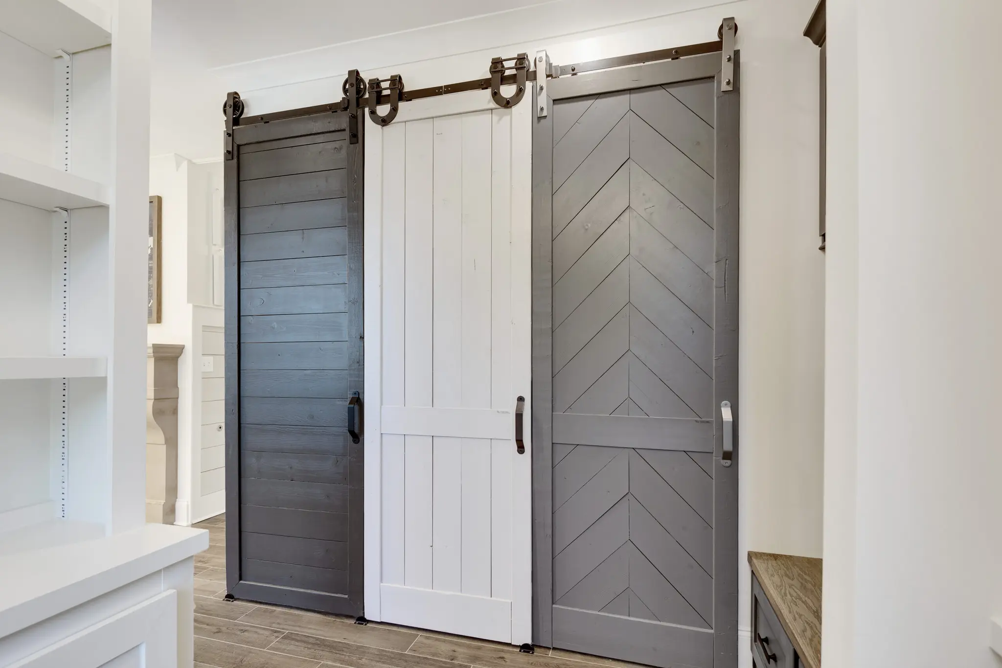 Magnolia Homes Design Center with 3 options for sliding barn doors in different styles!
