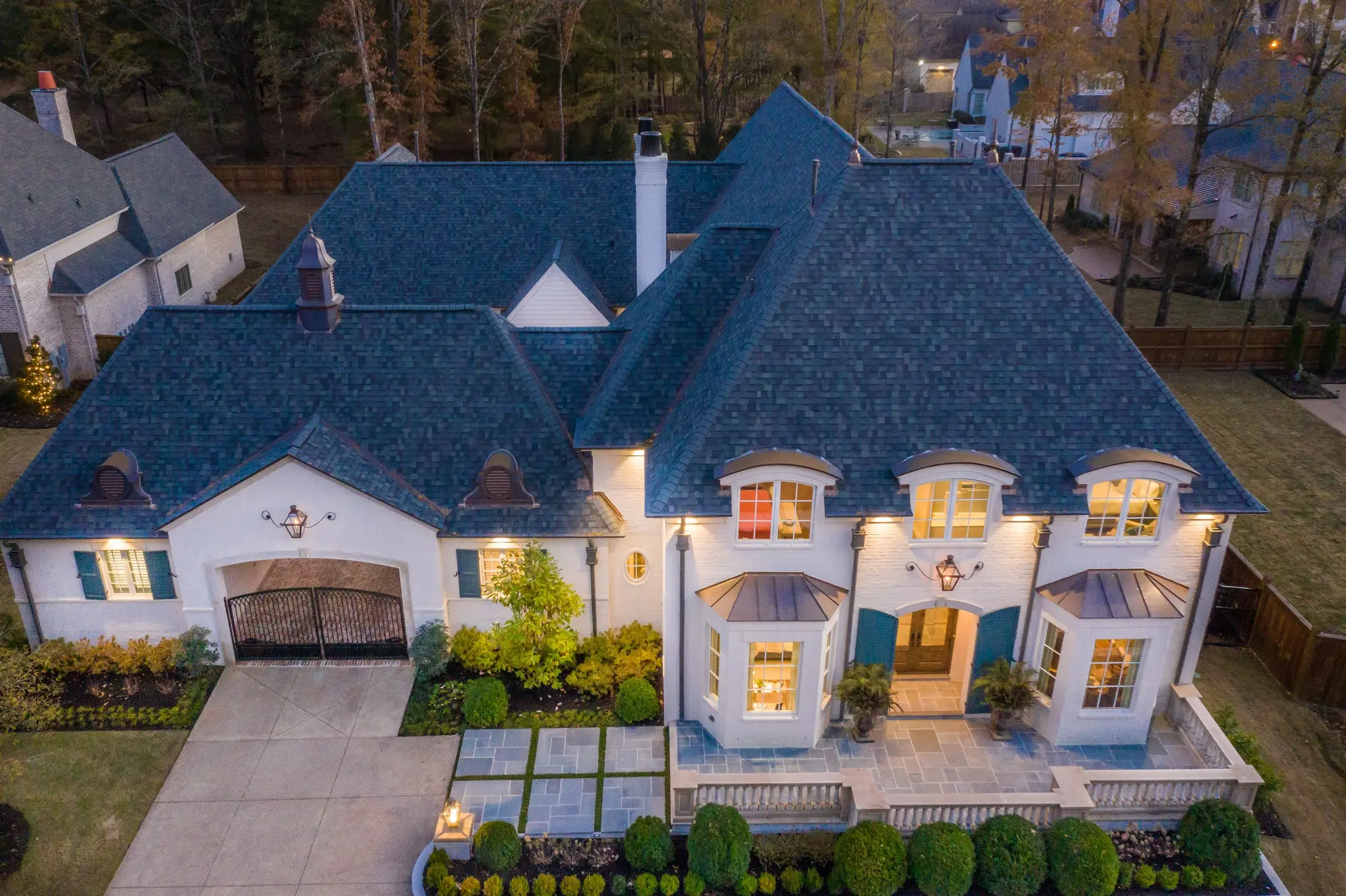 Magnolia Homes residence showcasing timeless exterior design at dusk and curated architectural details