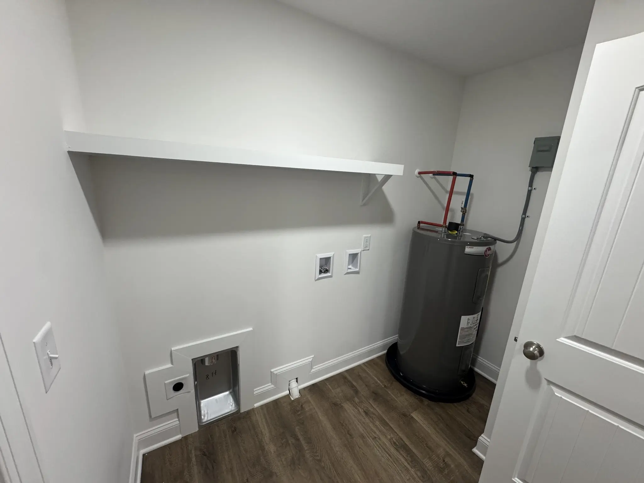 Spacious Laundry Room with Shelving